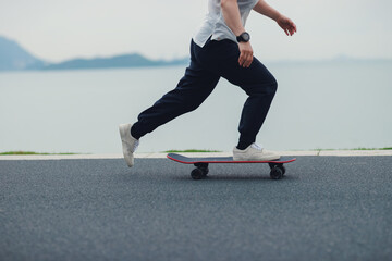 Skateboarder skateboarding at the seaside © lzf