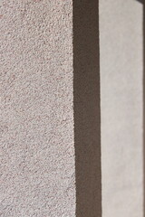 Fototapeta premium Bayramix mosaic plaster texture on house exterior wall