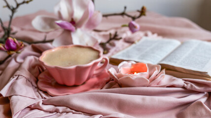 Naklejka premium Cozy morning ritual with coffee, book, and blooming magnolia flowers