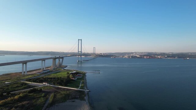 Osmangazi Bridge in Kocaeli, Turkey. Aerial shot with drone. Beautiful sunset landscape.