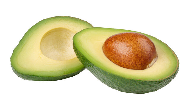 Ripe halved avocado with large brown seed and green skin