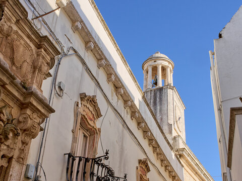 Locorotondo, Italy - July 30, 2025: Palazzo Morelli and Palazzo Comunale e Torre Civica, also called Torre dell'Orologio, Clock Tower. Locorotondo, Valle d'Itria, Bari, Apulia, Puglia, Italy, Europe