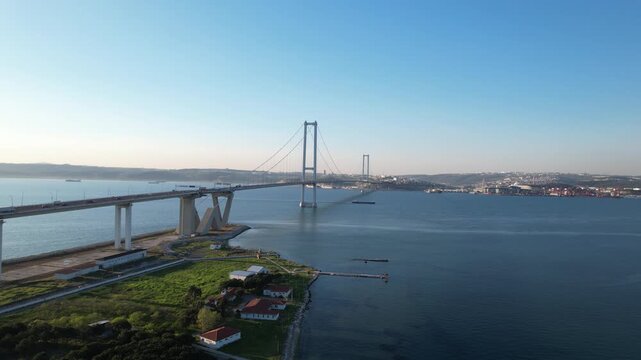 Osmangazi Bridge in Kocaeli, Turkey. Aerial shot with drone. Beautiful sunset landscape.