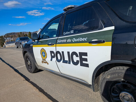 Quebec, Canada, 25 April 2026 : Surete du Quebec police patrol car is parked on a street under a blue sky.
