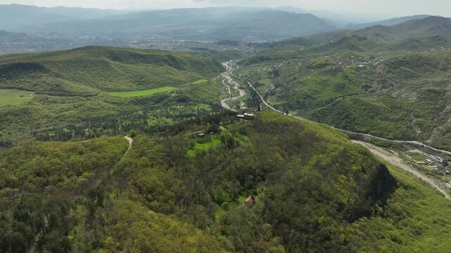 Aerial shot of the Mamkoda Monastery, located near Tbilisi. The image captures the historic stone architecture of the church and its surrounding monastic buildings