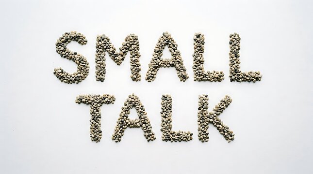 Intriguing Communication: The words SMALL TALK are artfully arranged from small stones on a smooth surface, creating a visual invitation to a realm of friendly chatter and social interaction.