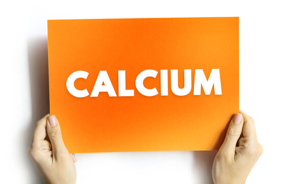 CALCIUM text on card held by hands, concept of nutrition, health, mineral, and bone strength
