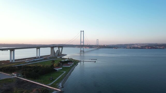 Osmangazi Bridge in Kocaeli, Turkey. Aerial shot with drone. Beautiful sunset landscape.