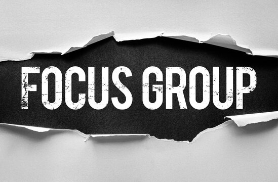 Word FOCUS GROUP in bold, distressed text is revealed through torn paper on background. Conceptual design for research, marketing, business insights, or strategic planning visuals