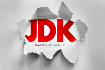 JDK Java Development Kit text emerging from torn paper style, software development concept...