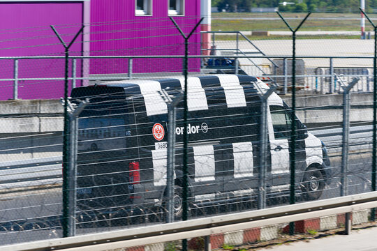 Side view of Condor truck with SGE livery passing at German Frankfurt Airport on a sunny spring day. Photo taken April 25th, 2026, Frankfurt am Main, Germany.