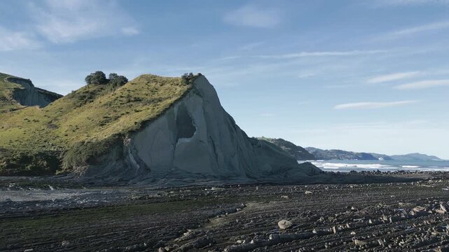 Stunning aerial view of the famous Flysch rock formations on Sakoneta beach in Zumaia, revealing layers of sedimentary rock along the picturesque coastline of the Basque Country, Spain