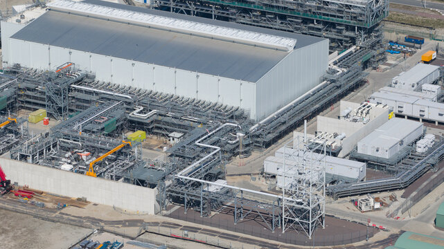 Drone view of Holland Hydrogen I on Tweede Maasvlakte, a major green hydrogen plant powered by offshore wind for sustainable industry and freight transport.