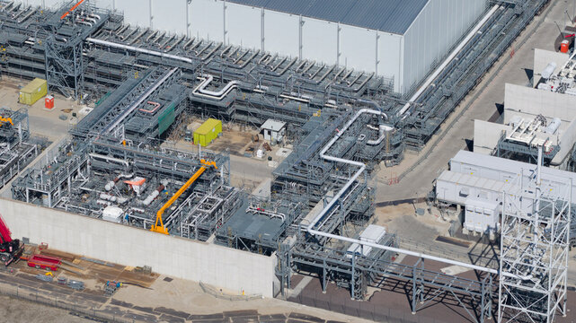 Drone view of Holland Hydrogen I on Tweede Maasvlakte, a major green hydrogen plant powered by offshore wind for sustainable industry and freight transport.