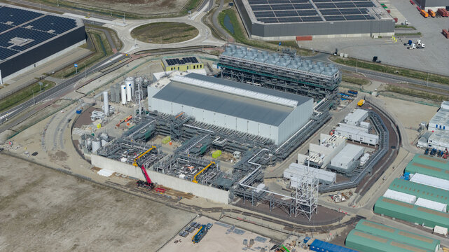 Drone view of Holland Hydrogen I on Tweede Maasvlakte, a major green hydrogen plant powered by offshore wind for sustainable industry and freight transport.