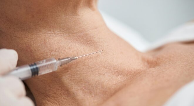 Skin booster injection into neck of mature patient