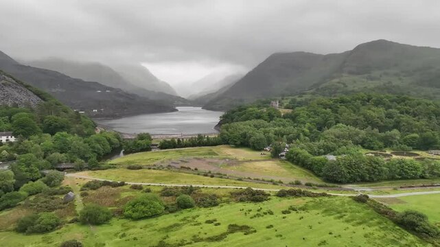Aerial Drone View of Llyn Padarn Lake Framed by Slate Mountains in Snowdonia Wales