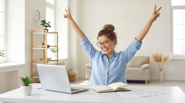 Excited office worker winner using laptop computer celebrating goal achievement. Happy young woman student or employee winning online getting good news in email raising hands feeling euphoric.