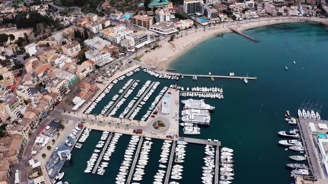 Port de S&oacute;ller, Mallorca, Spain - March 21, 2024: Breathtaking flying drone Aerial Perspective of Mediterranean Sea Harbor, Overflowing with Magnificent Luxury Yachts at Bustling Marina Docks and Port