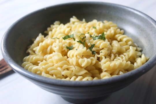 bowl of fusilli pasta on the table