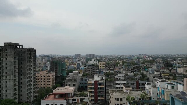 Aerial drone view of central Dhaka city skyline cinematic urban landscape Bangladesh 4K