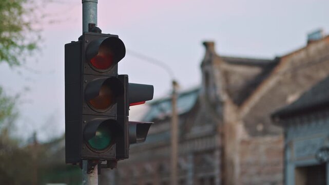 Close-up of traffic signal transitioning to red, road safety and regulation concept in city setting, 4K