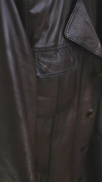 Close-up of a premium brown leather jacket texture and details