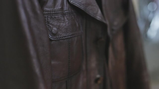 Close-up of a premium brown leather jacket texture and details
