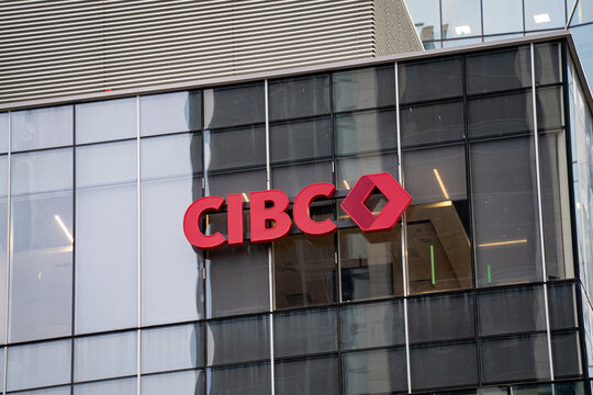 View of CIBC sign on modern glass building facade. Toronto, Canada - April 29, 2026.