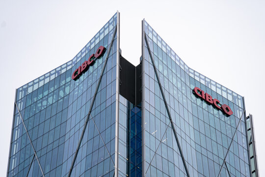 View of CIBC sign on modern glass building facade. Toronto, Canada - April 29, 2026.