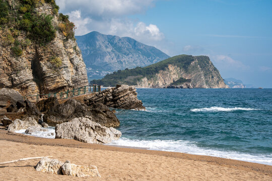 Scenic Mogren Beach with Layered Cliffs and St. Nicholas Island View - Budva