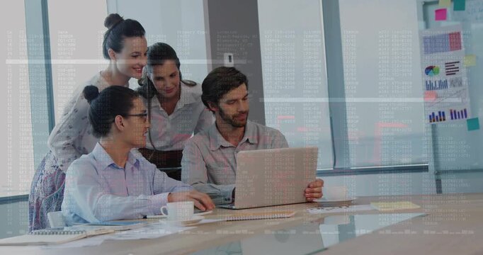 Team leaning over laptop woman pointing and starting animated charts while reviewing business data