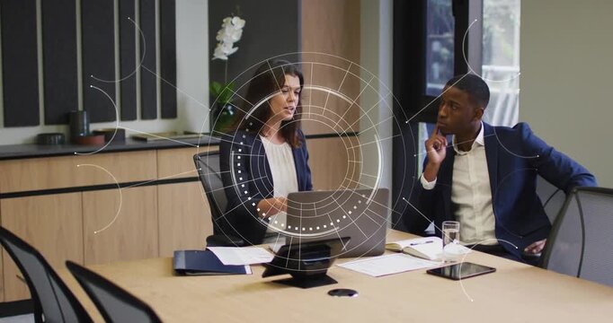 Woman guiding spinning business HUD appearing on device, man watching, reviewing docs and data