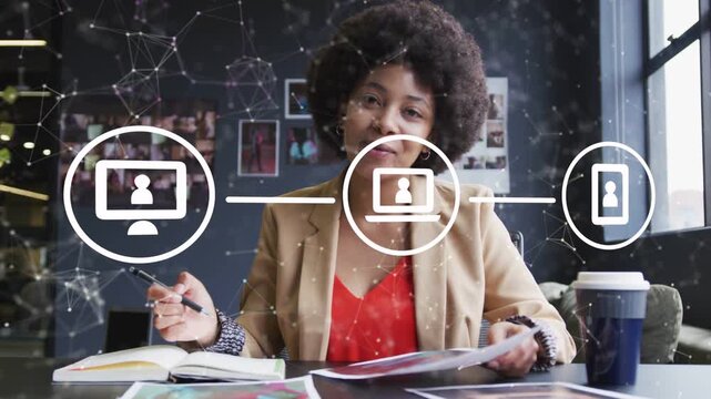 Woman flipping papers, scanning, starting animated three-node net, noting to coordinate tech team