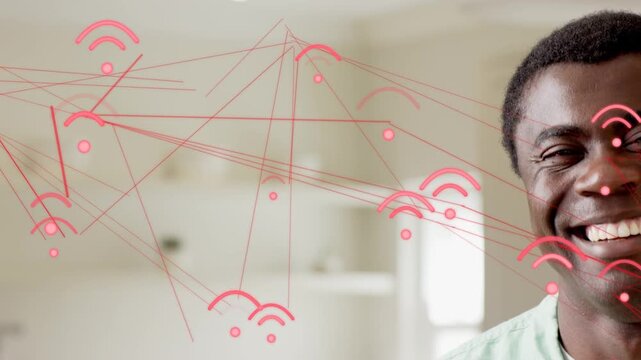 Man at home reacting to red tech network icons sweeping across frame smiling then calming