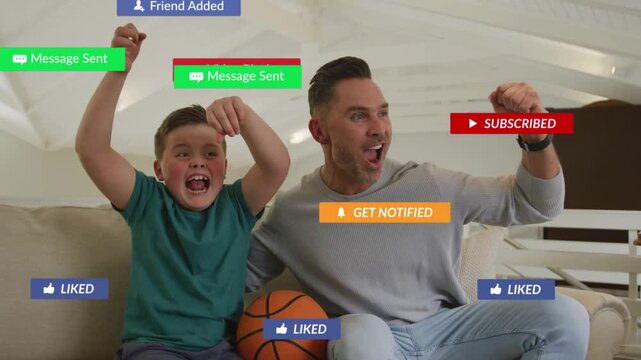 Father and son cheering with basketball on sofa, pumping fists, sparking social alerts, high-fiving