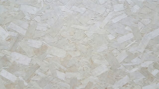 Painted wood chipboard showing textured panel surface background