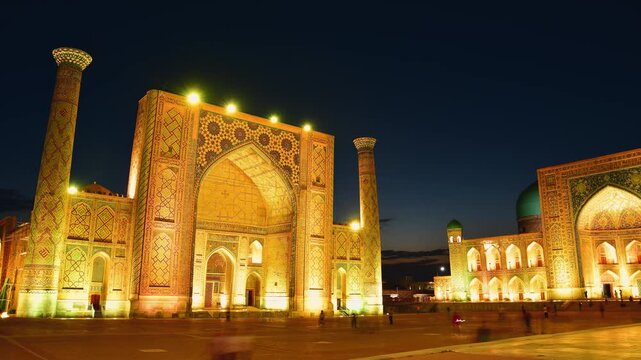 Samarkand, Uzbekistan - 15th february, 2025: spectacular timelapse Registan Square, Samarkand. Golden hour fades Ulugh Beg, Sher-Dor, Tilla-Kari Madrasahs illuminate against deepening blue twilight