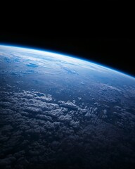 Fototapeta premium A mesmerizing view of Earth from space, showing the curvature, clouds, and atmosphere. The image evokes a sense of wonder and the vastness of the cosmos