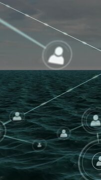 Vertical video: Bright streak appearing above sea, user nodes emerging, linking and mapping network