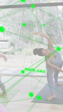 Vertical video: Right woman flowing side-bend for balance in yoga session forming AR node network