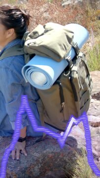Vertical video: Outdoor hiker pressing rock shifting adjusting pack viewing under purple waveform