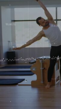Vertical video: Man starting at Pilates chair, doing side bends with graph overlay aiding balance