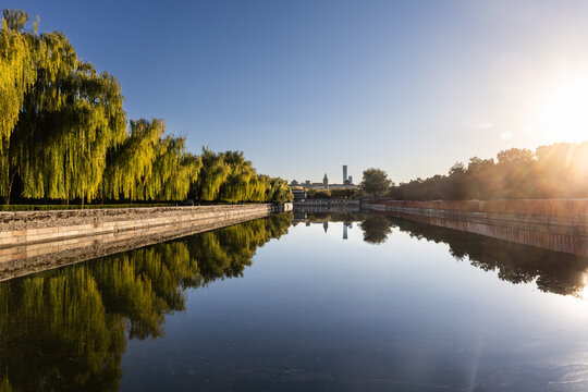 Scenic moat that surrounds Forbidden City in Beijing China during sunrise.