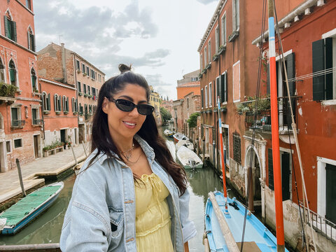 Beautiful  traveler woman on the street in Venice ,Italy 