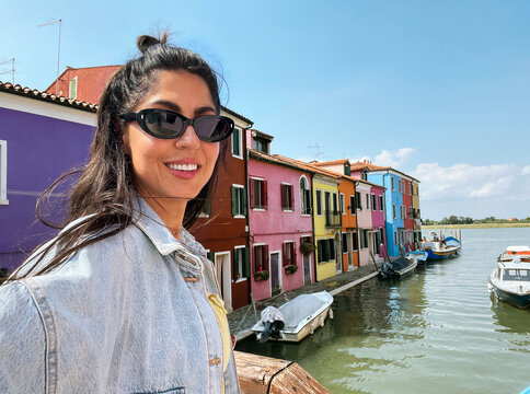 Beautiful smiling traveler  woman   in Burano ,Italy