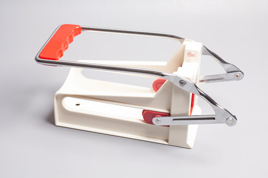 French fries cutting machine, manual potato cutter slicer on white background