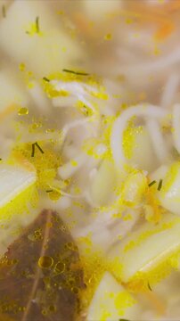 Fresh herbal noodle. Savory homemade soup with herbs. Warm bowl of handcrafted noodle broth with herbs. Comforting homemade noodle soup garnished with shredded eggs and dill