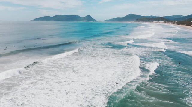 Aerial view of the wave breaking on the shore in Brazil