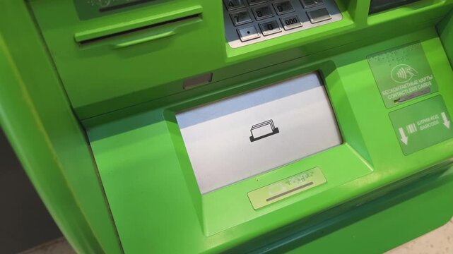 ATM machine process showing cash being deposited into a card, with funds being added to an account, highlighting the transaction steps in a financial setting